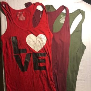 Variety of Tanktops, Burgundy, Green, and Red.